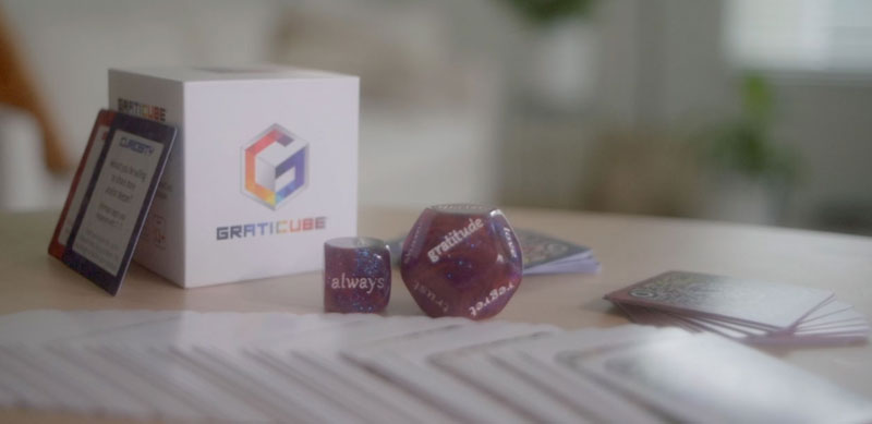 Graticube game set with cards and dice to explore deep connection in curiosity and gratitude. 
